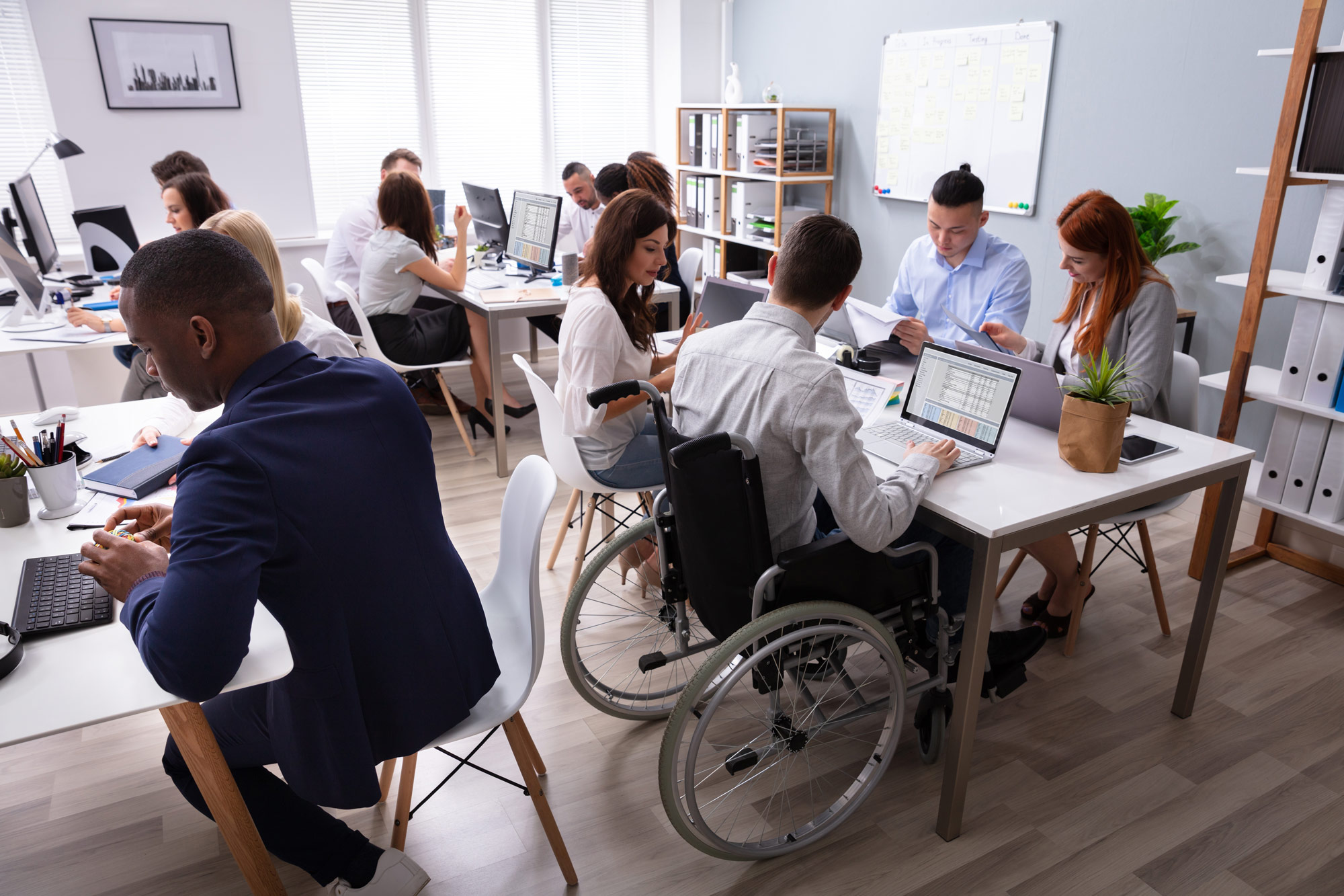 a diverse group of employees working together in an office