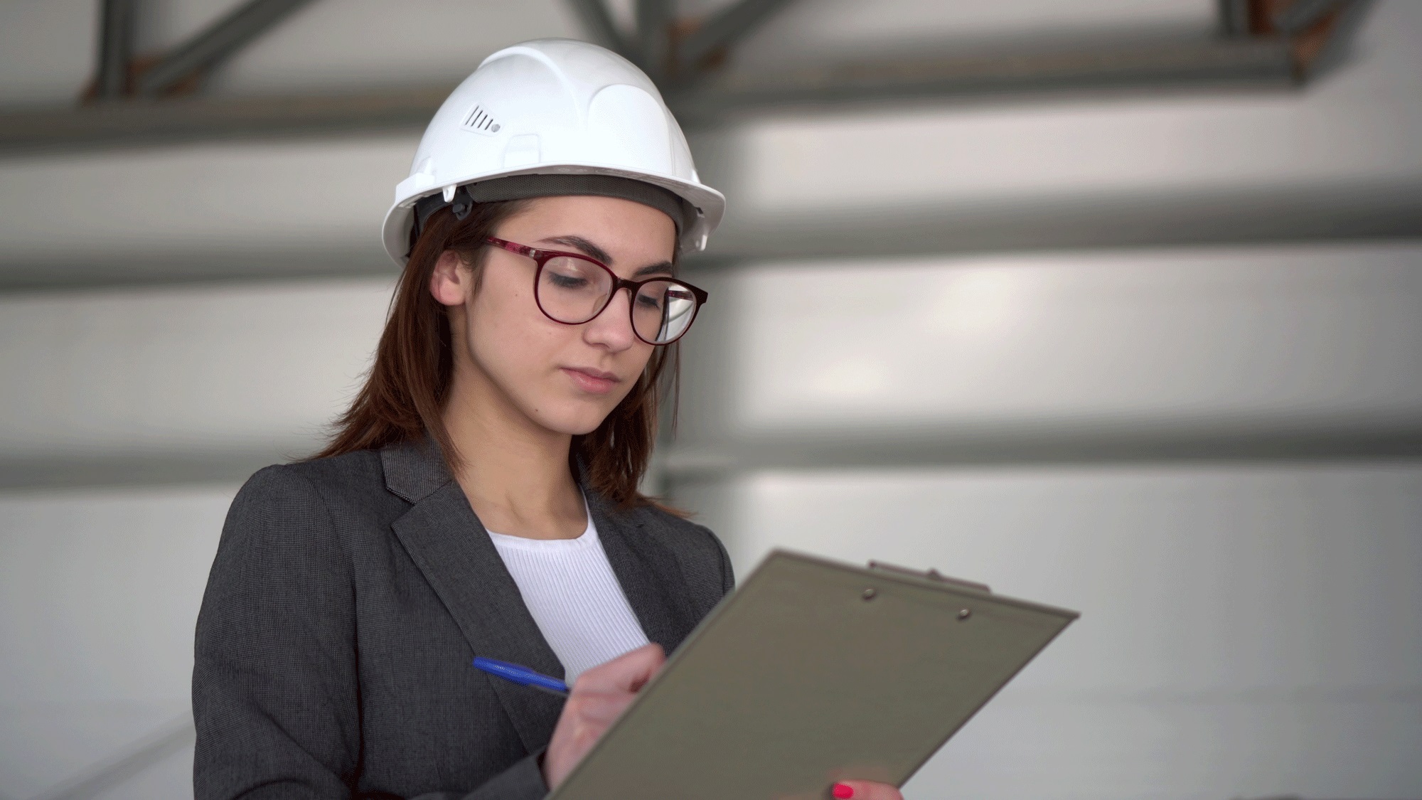 female ehs worker recording an injury or illness on a clipboard