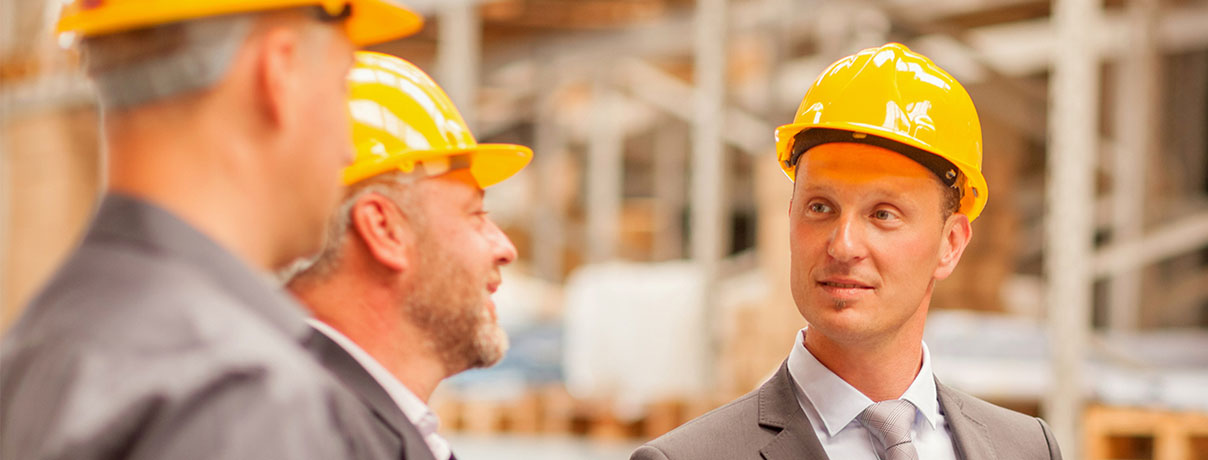 Group of business people in warehouse