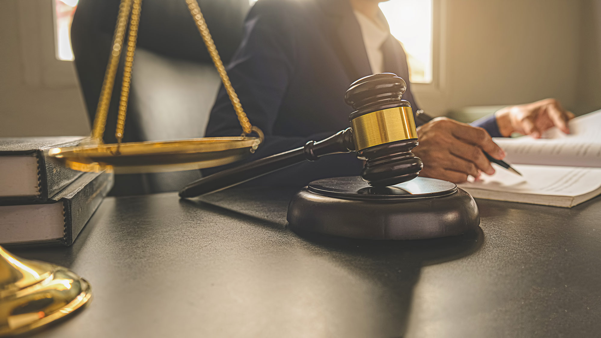 person-at-desk-with-gavel