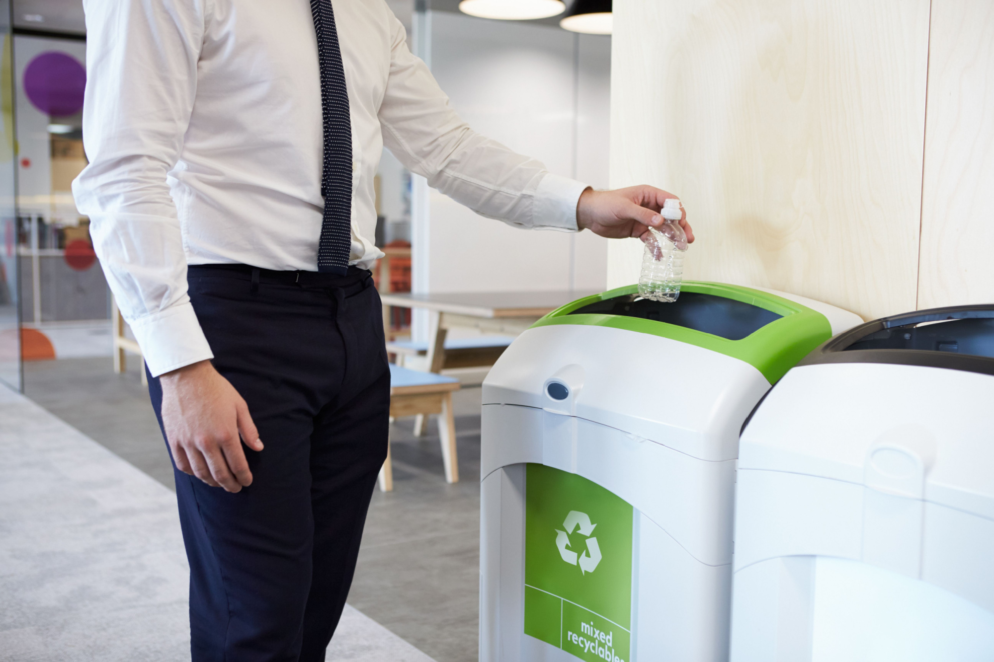 man sorting recycling at work