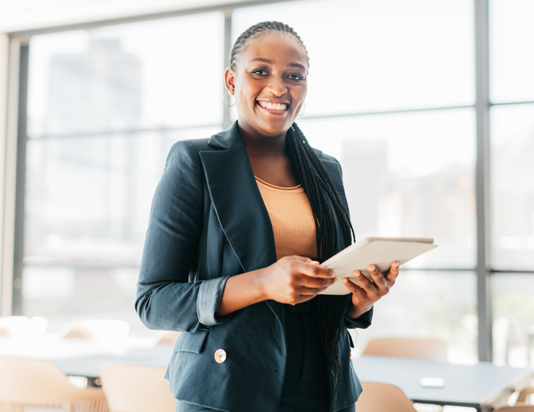 woman-smiling-holding-a-tablet