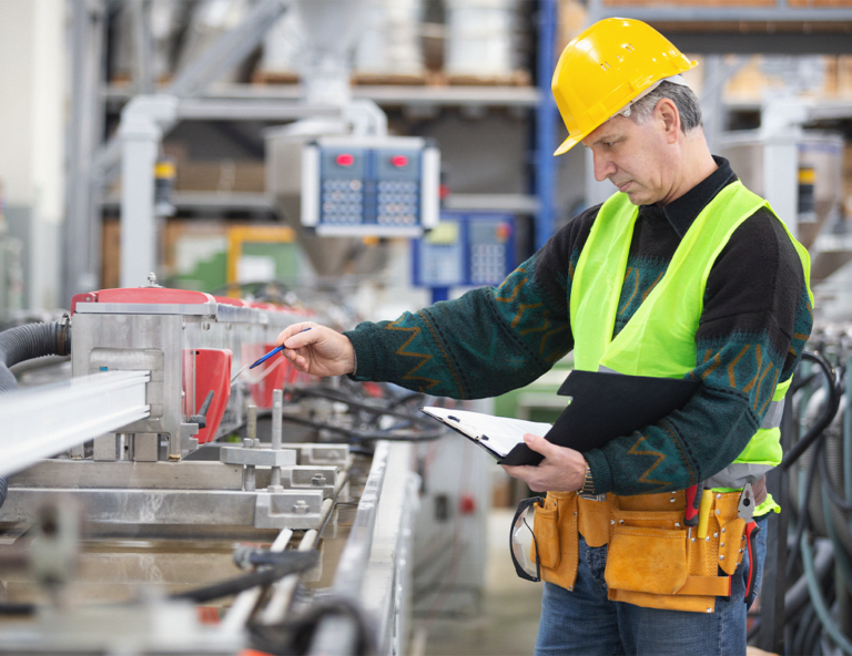 factory-worker inspecting-equipment