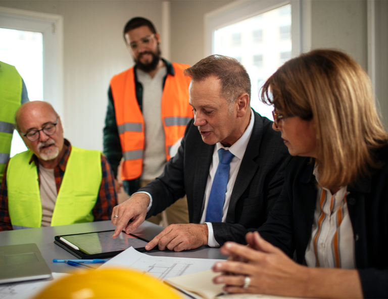 employees-and-managers-at-conference-table