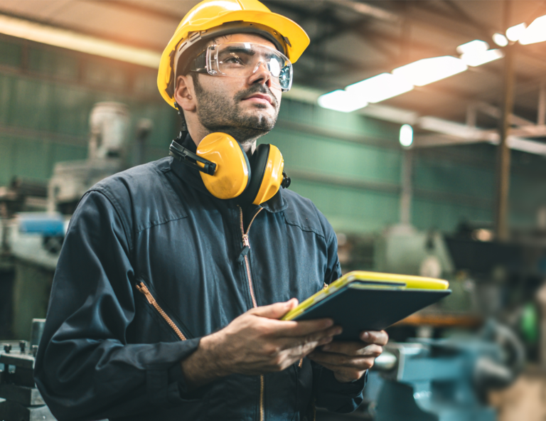 worker-in-PPE-using-a-tablet