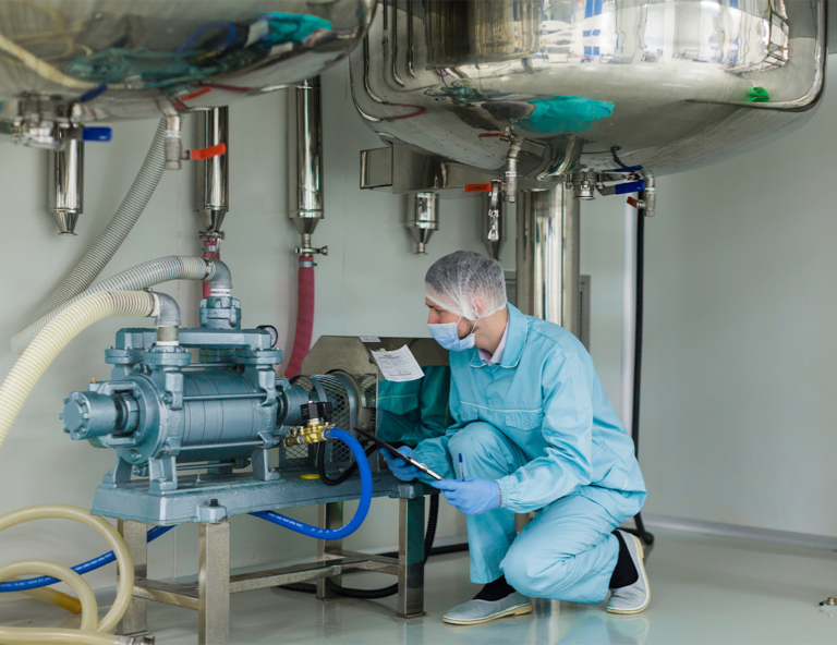 worker-in-a-lab-inspecting-equipment