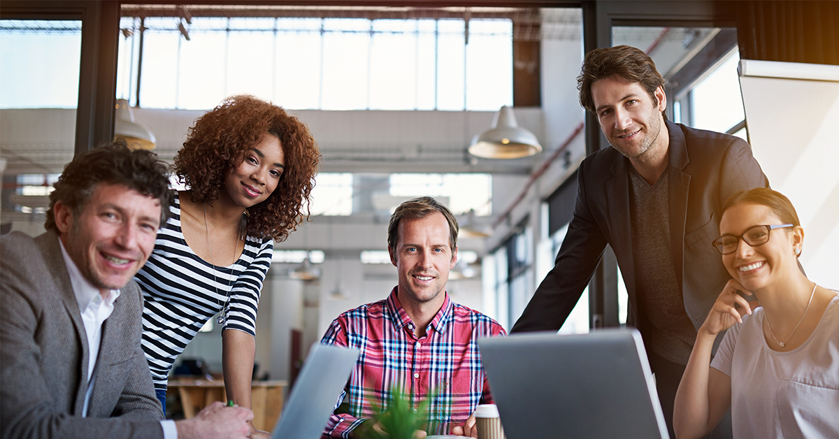 smiling coworkers in a conference room